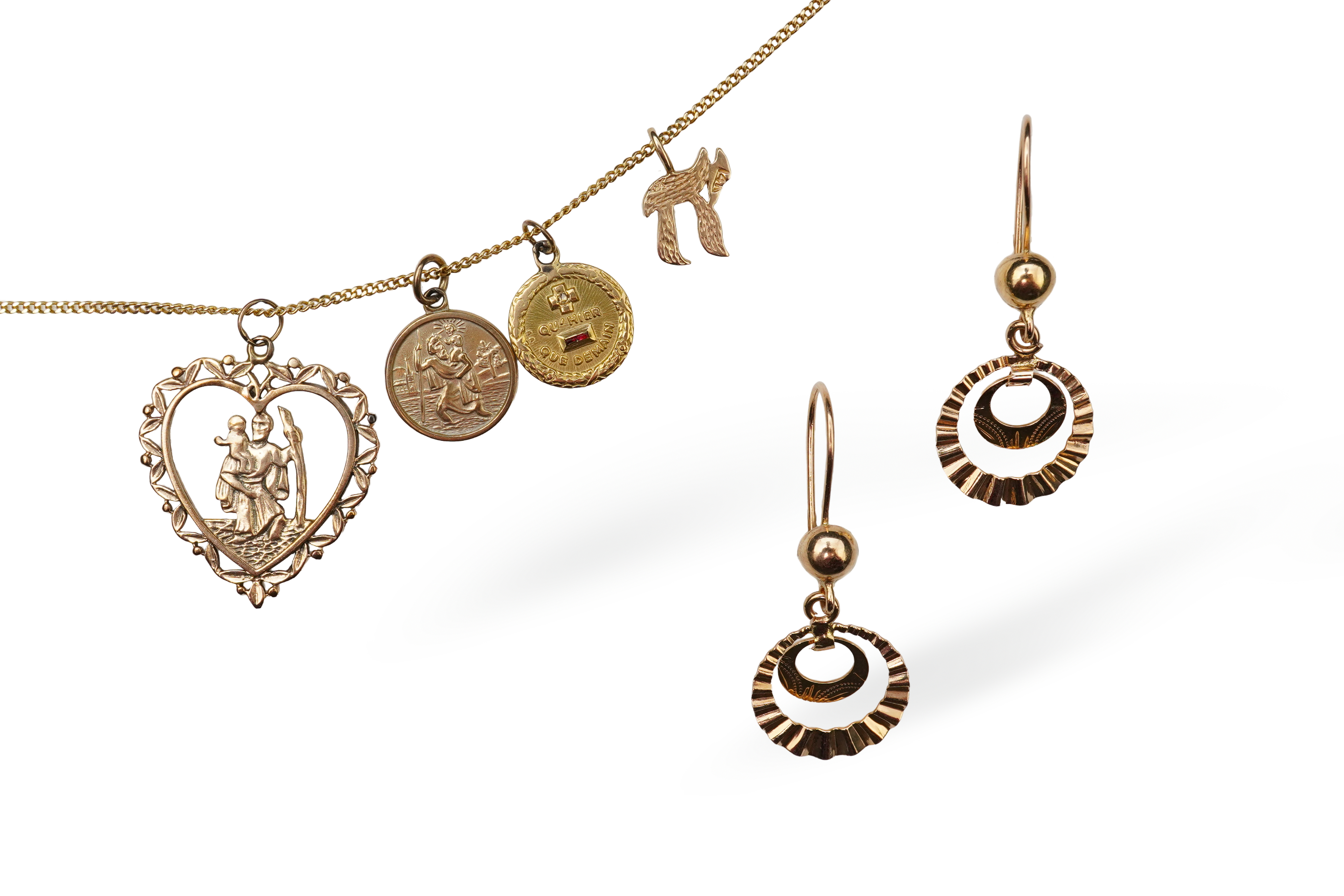 A gold necklace and pair of earrings